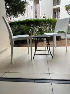 a table and two chairs sitting on a patio at Dainfern Luxe Living - 2 Bed in Fourways