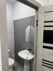a bathroom with a sink and a toilet at Manes in Yeghegnadzor