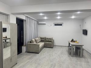 a living room with a couch and a table at Manes in Yeghegnadzor