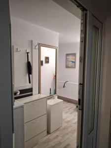 a bathroom with a sink and a mirror at Ultracentral STUDIO Koket in Arad +16 photos