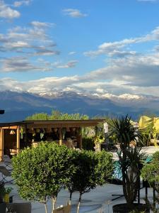 a view of the mountains from a resort with trees at Ikalto Woods in Telavi