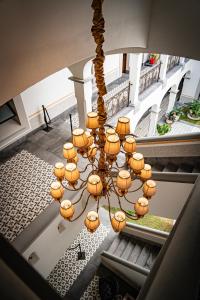 a chandelier hanging from the ceiling of a building at Hotel Emperador Orizaba in Orizaba