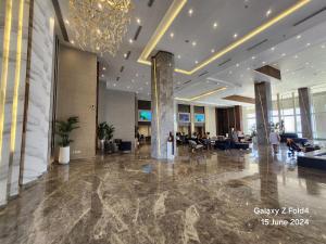 a lobby of a hotel with a chandelier at Cosy Romantic Sea View Villa at a 5 Hotel in Sharm El Sheikh