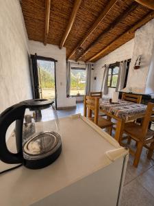 a kitchen with a appliance on top of a counter at Cabañas El Cardón in Maimará