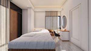 a bedroom with two beds and a mirror at Hotel Adi International in Rājshāhi