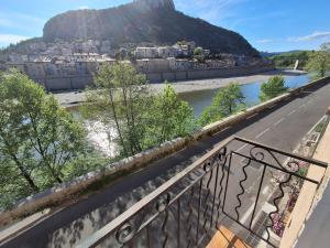 a view of a river from a balcony at The Cévennes break in Anduze