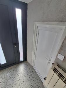 an empty room with a door and a window at The Cévennes break in Anduze