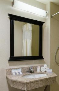a bathroom with a sink and a mirror at AMTD Idea Tribeca Hotel in New York +20 photos