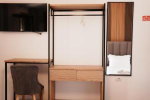 a small room with a desk and a chair at Hotel Lula Ksamil in Ksamil