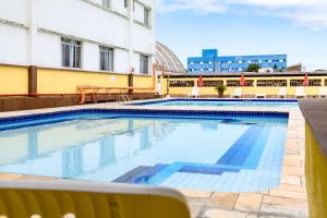 a large swimming pool on top of a building at USCEESP Itanhaem in Itanhaém +26 photos