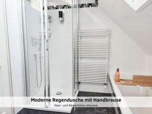 a bathroom with a shower and a sink at GlanzExperts Auszeit bei Berlin Balkon Kicker & DisneyPlus in Zossen +60 photos