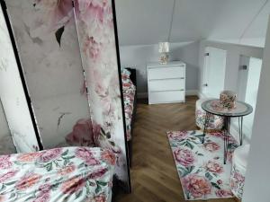 a room with a bed and a table and chairs at KLIMKOWSKA osada in Klimkówka