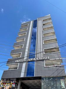 a hotel amarantiss building with a sign on it at Hotel Araamish in Peshawar