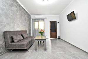 a living room with a couch and a table at free shuttle in Zvartnots International Airport