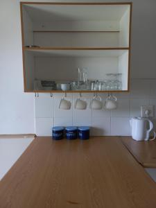 a kitchen with three blue buckets on the counter at Pecan Cottage 2 in Machadodorp