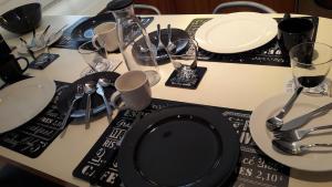 a table with plates and forks and glasses on it at venice la pergola n 3 in Spinea