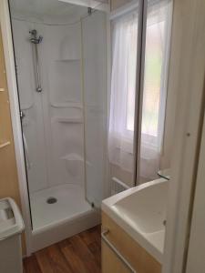 a bathroom with a shower and a sink at Chez François in Crouay