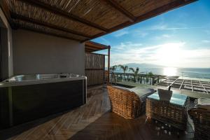 a kitchen with a view of the ocean at Lost Seaside Hotel - Adults Only in Sarandë
