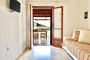 a living room with a couch and a table at Vista Petros in Apraos