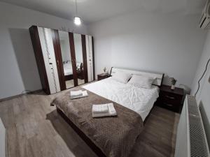 Un pat sau paturi într-o cameră la Dixi Studio +1 fotografie
