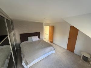 a bedroom with a large bed in a room at Relax In Belfast in Belfast