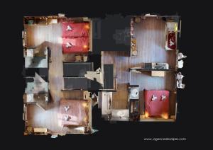 a floor plan of a room with red furniture at Chalet De Manou - Chalet individuel rénové pour 12 personnes avec sauna dans les 3 Vallées MAE-3694 in Saint-Martin-de-Belleville +3 photos