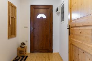 a wooden door in a room with a wooden floor at Pr' Sokrat in Radovljica