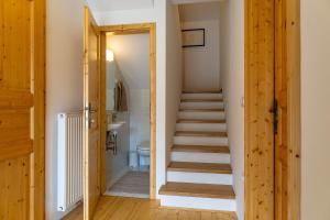 a staircase leading up to a bathroom with a stair case at Pr' Sokrat in Radovljica