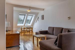 a living room with a couch and a table at Pr' Sokrat in Radovljica