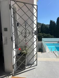 a glass door with a plant on the side of a house at Casa Roca Maura in L'Estartit