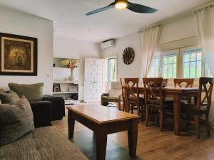 a living room with a table and a dining room at Casa Rural MONTE VERDE in Illana