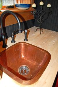 a sink in a kitchen with a wooden counter top at Timber Ridge in Franklin