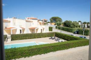 a view of a house with a swimming pool at Sun & Salt Villa in Alvor