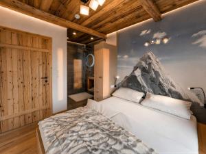 a bedroom with a large white bed in a room at OLDWOOD CHALET - Design Chalet & Balcony in Fügen