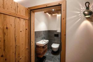 a bathroom with a toilet and a sink at OLDWOOD CHALET - Design Chalet & Balcony in Fügen +23 photos
