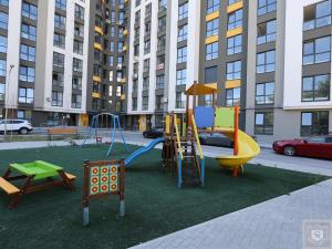 a playground with a slide at RentHouse Apartments Panoramic-Airport-Studio in Chişinău