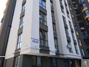 a building with a kdd sign on it at RentHouse Apartments Panoramic-Airport-Studio in Chişinău +6 photos