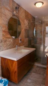 a bathroom with a sink and a mirror at Quinta San Ignacio in Guadalajara