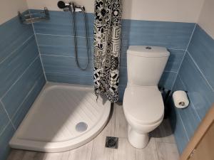a bathroom with a toilet and a shower curtain at Castle View #3-4 in Kavála +34 photos