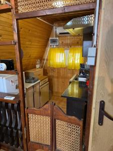 a small kitchen with a counter and a counter top at Vikendice Garić in Veliko Gradište