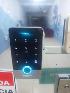 a close up of a smart phone in a store window at pousada mar livre in Aracaju