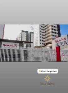 a view of a city with a fence and buildings at pousada mar livre in Aracaju