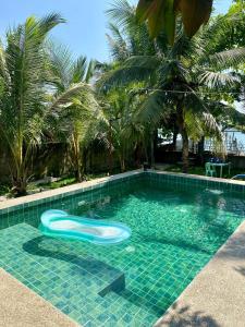 a swimming pool with a frisbee in the water at Casita Agnes Private Resort in Boac
