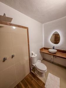 a bathroom with a toilet and a sink at Amaizing view Islas Marietas in Punta Mita +15 photos