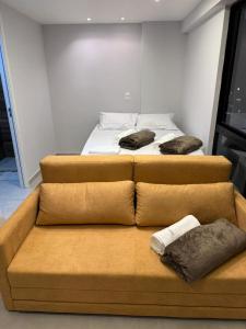 two beds sitting next to each other in a room at Carneiros Pernambuco in Tamandaré