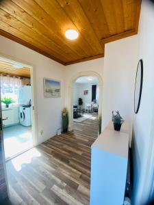 a kitchen with wooden ceilings and a wooden floor at Spacious House for Families & Workers in Skelleftehamn