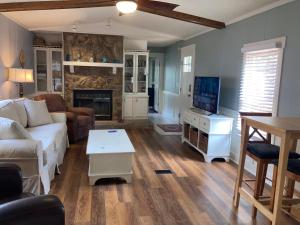 a living room with a couch and a fireplace at Beaufort SC New Renovation, Close to Parris Island, Historic Downtown, Beautiful Beaches, Sleeps 6 in Beaufort