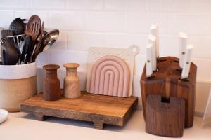 a kitchen counter with a cutting board and utensils at Cottage Three - Hidden Gem on Hanalei River in Hanalei