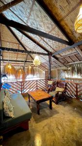 a large room with a table and chairs in it at Ginhawa Stay Mixed dorm 6 Bed in Burgos +25 photos