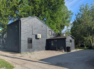 a building with a basketball hoop on the side of it at The Raven in Madison